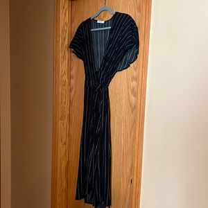 Perfect for summer.  New black and white wrap dress.  Never worn.